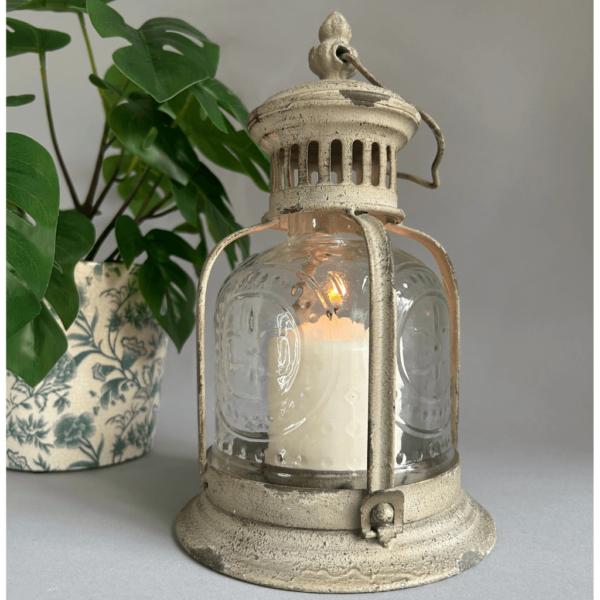 Vintage style hurricane lantern with distressed aged finish