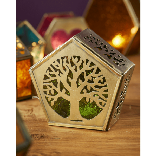 A pentagon shaped metalwork and green glass standing tealight lantern.